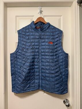 The North Face Men's Quilted Jacket in Blue with Orange Interior
